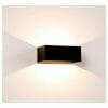 The Mia black up and down wall light features a rectangular design that casts light upward and downward, creating geometric patterns on white walls.