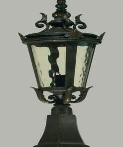The Albany pillar mount is a black, vintage-style outdoor lantern featuring a glass enclosure, decorative metal accents, and a square base.
