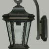 The TILBURN MEDIUM WALL BRACKET features a black metal outdoor wall lantern with a curved arm and textured glass panels, mounted on a rectangular medium wall bracket.