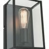 The Manchester wall light is a black metal and glass wall sconce with an exposed Edison-style bulb, adding a modern industrial touch.