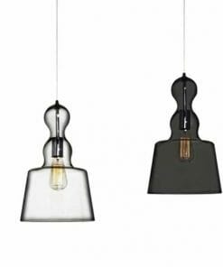 Two Campana Glass Pendant Series lights—one with a clear shade, the other with a dark translucent shade—hang on cords against a white background.