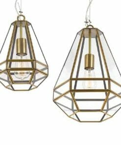 Two geometric Espada pendants with brass frames and clear glass panels, each showcasing an exposed bulb suspended from a cord.