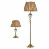A set of Oxford floor lamp and table lamp, both featuring striped beige lampshades and clear glass accents on the stems.