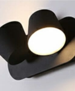 A sleek black Yarra LED Wall light (Duo) with a cylindrical shade emits bright light against a white background.