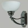 The Houston 1Lt wall light showcases a chrome base and arm with an upward-facing frosted glass shade, creating a sleek, modern look perfect for any space.