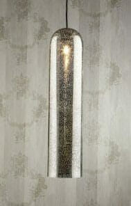 A pendant light featuring the Moroccan Brass pipe and a metallic speckled finish hangs in front of patterned wallpaper.