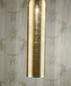 The Moroccan Brass pipe pendant light, featuring a tall cylindrical design, hangs from the ceiling against a patterned wallpaper background.