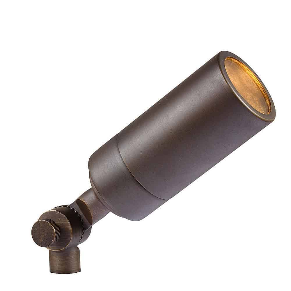 The Laiton Antique Brass outdoor landscape spotlight features an adjustable head and is shown in an angled position.