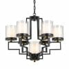 The Alvarez 7 pendant is a modern black metal chandelier with five cylindrical glass shades, each holding a bulb and suspended by a chain.