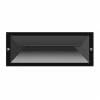 The Brick exterior wall light is a rectangular black fixture recessed into the wall, viewed from the front with screws visible on both sides.