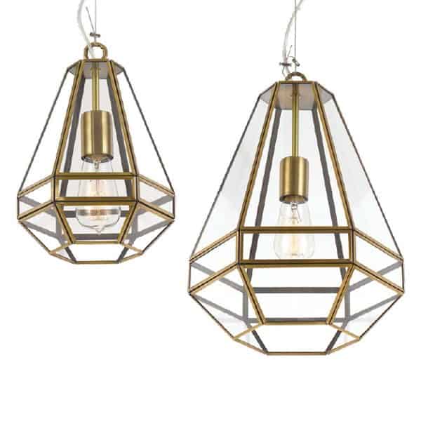Two geometric brass and glass pendant lights, each with an exposed bulb, hang against a white background. Their style is similar to the Espada 30 black pendant.
