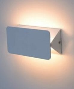 The Pivot wall light 6W is a modern rectangular sconce that emits soft, warm light against a white wall.