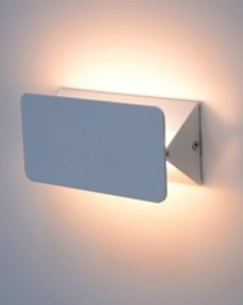 The Pivot wall light 6W is a modern rectangular sconce that emits soft, warm light against a white wall.