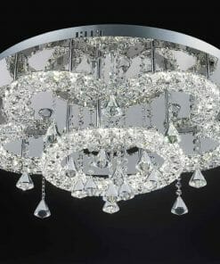 Modern ceiling chandelier with circular design, featuring Lugos C-7039 crystal CTC rings and hanging pendants against a black background.