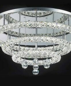 A modern chandelier with crystals hanging from it.