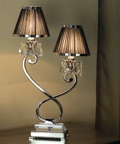 The Luxuria 2 light table lamp showcases two brown pleated shades, elegant curved arms, crystal accents, and a rectangular base for a refined touch on any wooden surface.
