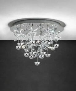 Modern ceiling chandelier named Pianopoli Crystals CTC features silver and glass floral elements with multiple hanging crystal and metallic bulbs, creating a striking look against a dark wall.