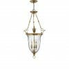 The Cambridge 3 small range brass pendant lantern showcases three candle-style lights with decorative rods and chains, a clear glass shade, and timeless design from our collection.
