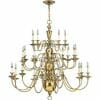 The Cambridge 3 small range chandelier features multiple curved brass arms, each with a candle-shaped bulb, suspended from the ceiling—ideal for bringing classic elegance to compact spaces or Cambridge-style interiors.