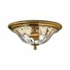 A flush mount ceiling light from the Cambridge 3 small range, made of brass and glass, with a decorative beaded rim and central exposed bulb.