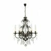 The Louis 15th 24 bronze is a black metal chandelier featuring eight candle-style bulbs, hanging glass crystal ornaments, and ornate bronze accents.