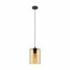 The Castralvo 5 pendant light showcases a black ceiling mount, black cord, and a cylindrical amber glass shade that elegantly displays the exposed bulb within.