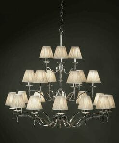 The Standford 21 Chrome Shimmer grey chandelier boasts a polished chrome frame, multiple cream lampshades, and subtle grey accents, creating elegant depth with its multi-tiered design.