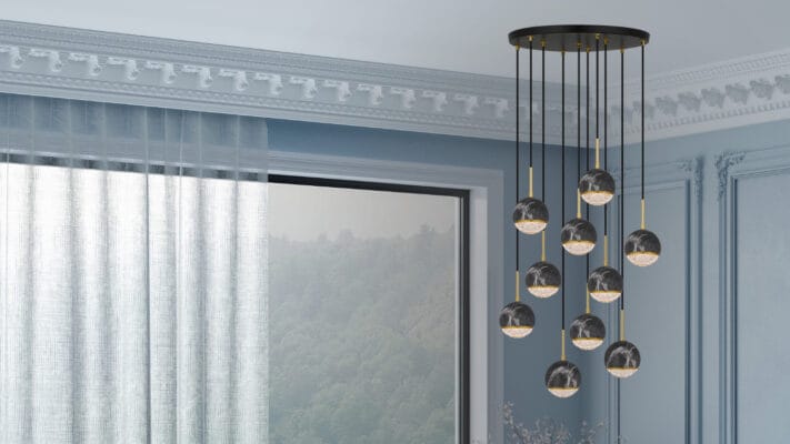 A lighting store with blue walls and an Onetta 10 cluster black hanging above a window.