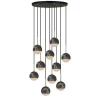 The Onetta 10 cluster black chandelier features ten black marble globe pendants, each suspended at different heights from a round black ceiling mount.