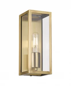 The Arazano 25 Solid Brass Wall Light is a rectangular sconce with clear glass panels and an exposed bulb.