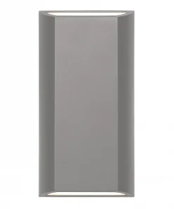 The Bloc LED Up-Down Wall Light features a rectangular gray design with beveled edges and emits light both upwards and downwards.