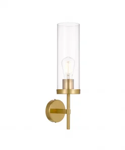 The Garot Wall Light is a modern gold wall sconce with a cylindrical clear glass shade, exposed bulb, and round base.