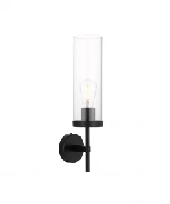 The Garot Wall Light is a black wall sconce with a cylindrical clear glass shade, exposed bulb, and round backplate.