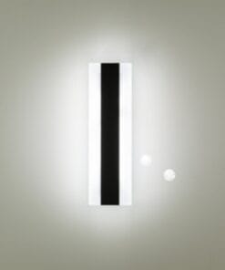 The Berlin 30 Range rectangular wall-mounted light fixture, with a black vertical stripe, brightens a plain light-colored wall.