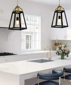 Modern kitchen interior with pendant lights and flowers.