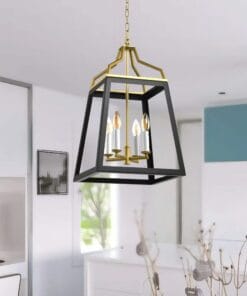 Modern gold-accented pendant light in white kitchen.