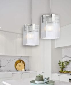 Modern kitchen with elegant pendant lights and marble backdrop