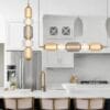 Elegant hanging lights over modern kitchen interior