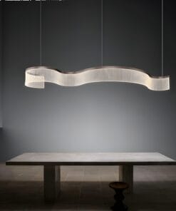 Modern curved light above minimalist concrete table