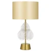 Gold base table lamp with white leaf pattern shade