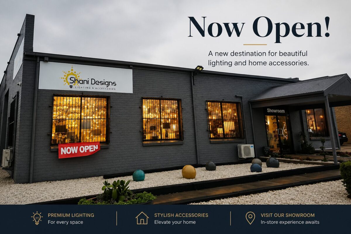 Exterior of Shani Designs lighting showroom in Melbourne, featuring large windows that showcase stunning lighting and home accessories, along with a "Now Open" banner and promotional offers.